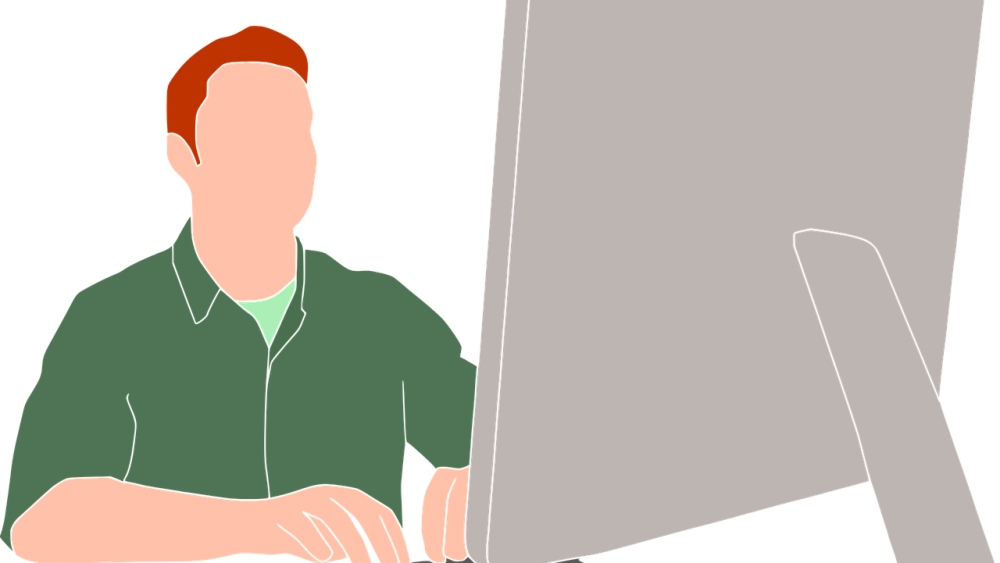 Person sitter vid dataskärm och skriver på tangentborg. Bild från pixabay.